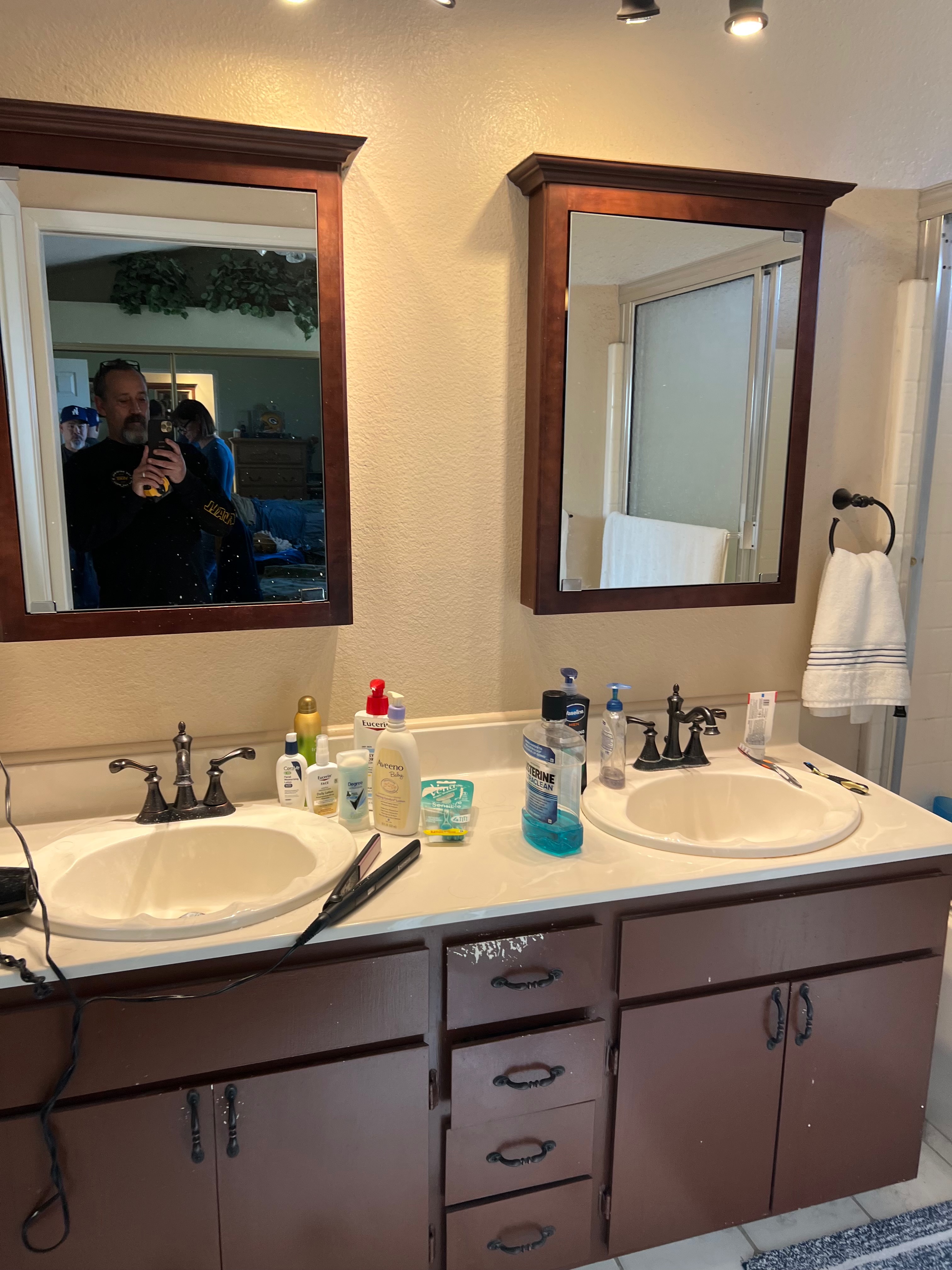 Before photo of outdated dark wood double vanity bathroom remodel Riverside CA